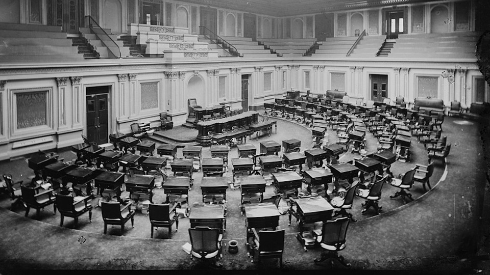 Black-and-white photo of an empty Senate