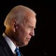 Joe Biden's head and shoulders are shown in profile against a black background.