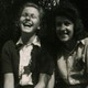 Marion Ehrlich and Ruth Preuss laughing together. They are wearing Stars of David.