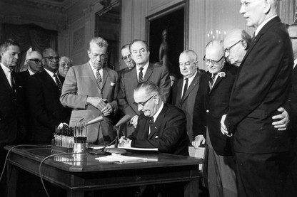 President Lyndon Johnson signs the Civil Rights Act on July 2, 1964.