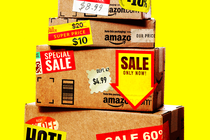 An image of Amazon boxes with sale stickers on them