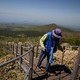 A hiker ascends stairs on a mountain in South Korea.