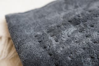 A close-up of a PureRelief heating pad