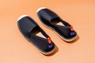 The Sea Star Beachwear Beachcomber Espadrille, one of our picks for the best water shoes, in classic black with light stitching.