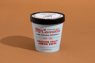 A pint of McConnell’s Passion Fruit Lemon Swirl dairy-free ice cream.