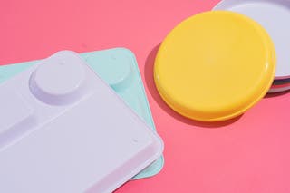 The underside of the 10-inch-square divided tray (left) and the 7-inch Plastic Kids’ Dinner Plates (right).