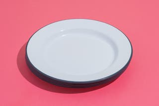 A stack of Falcon Enamelware’s plates with a gray trim.