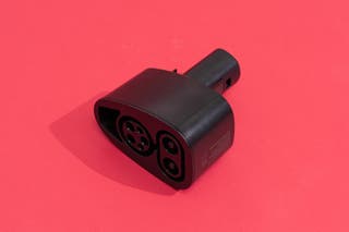 Lectron CCS to Tesla 300A EV Adapter on display in front of a red background.