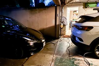 Two electric cars plugged in using the The Grizzl-E Duo charger.