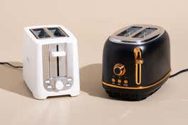 The Bella 2-Slice Toaster (left) and the Heritage 2-Slice Wide Slot Toaster (right) pictured on a tan background, two other toasters worth considering.