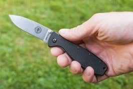 A hand holding the zancudo pocket knife.