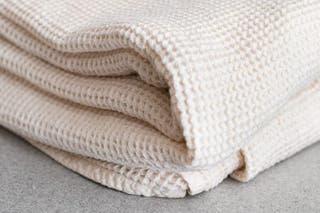 The Boll & Branch Waffle Blanket, one of our picks for best blanket.