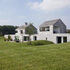 Fort-like House Design: Partially Submerged Twin Narrow Structures Connected by Continuous Carport