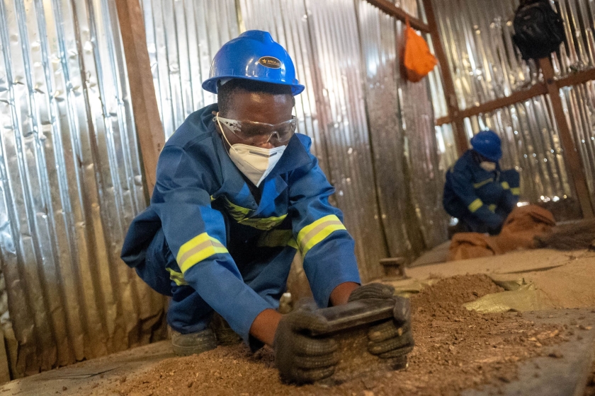 A man digging in the dirt 