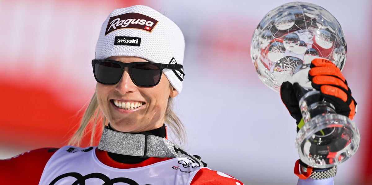 Lara Gut-Behrami of Switzerland celebrates with the overall women's giant slalom crystal globe trophy in the finish area during the second run of the women's giant slalom race at the FIS Alpine Skiing World Cup finals in Saalbach-Hinterglemm, Austria, Sunday, March 17, 2024. (KEYSTONE/Gian Ehrenzeller)