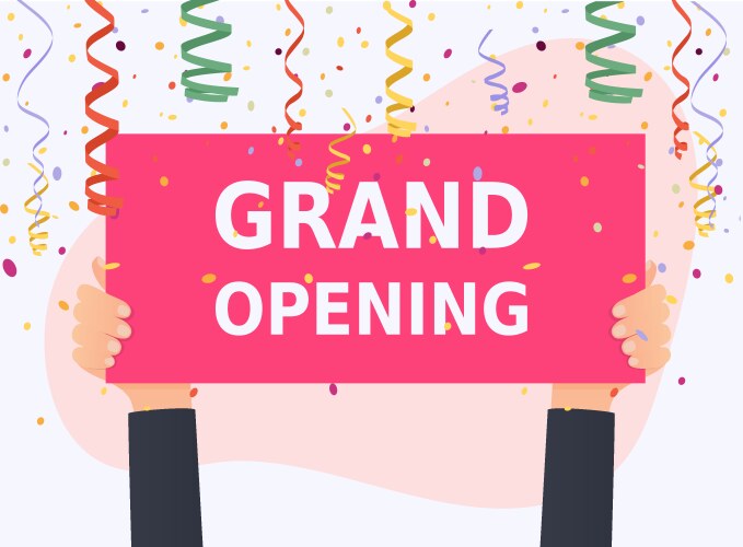 hand holding grand opening banner colorful vector image