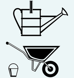 garden wheelbarrow and watering can vector image