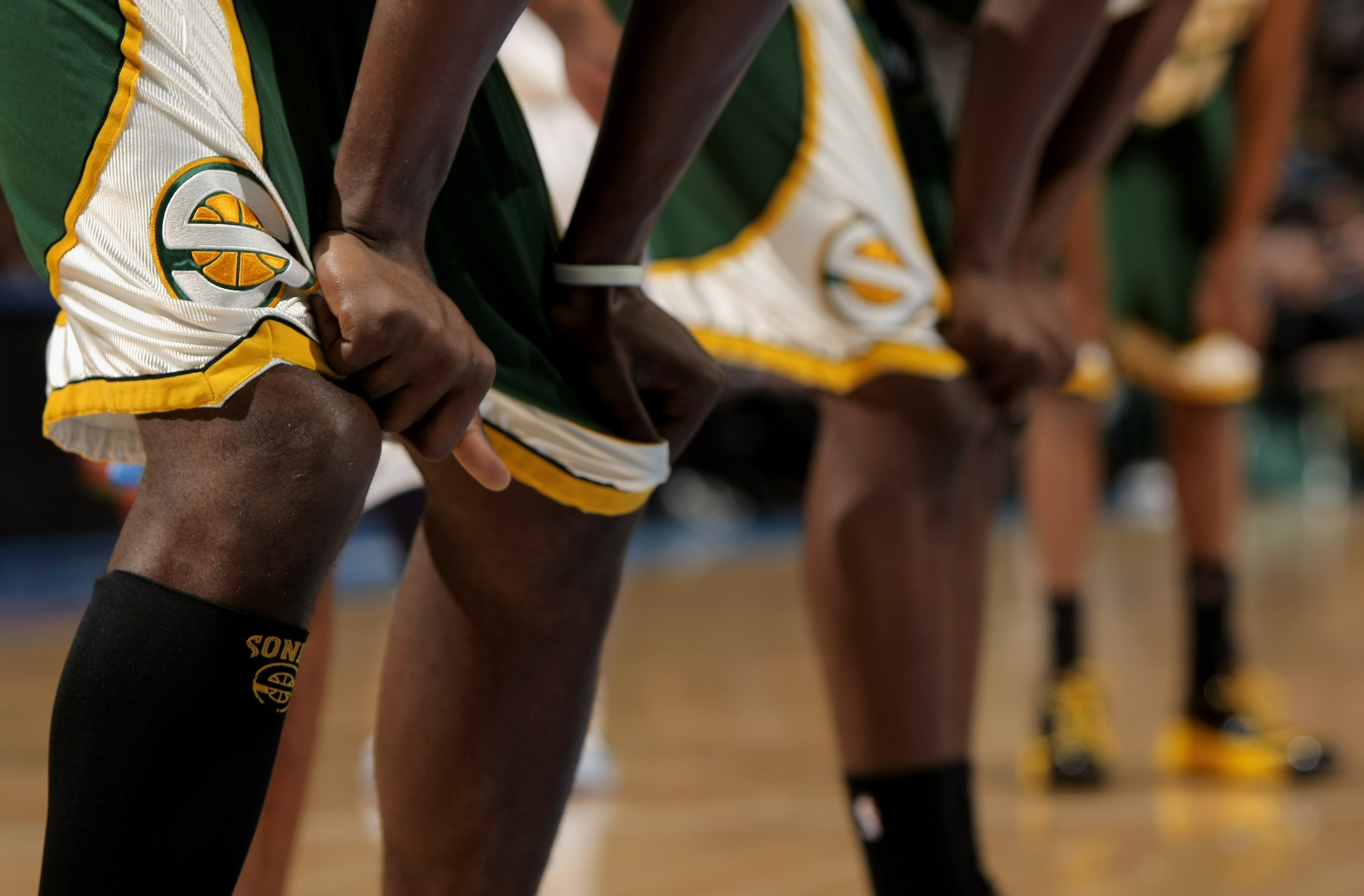 Members of the Seattle SuperSonics grabs their shorts as they are trounced by the Denver Nuggets at the Pepsi Center March 16, 2008 in Denver, Colorado.