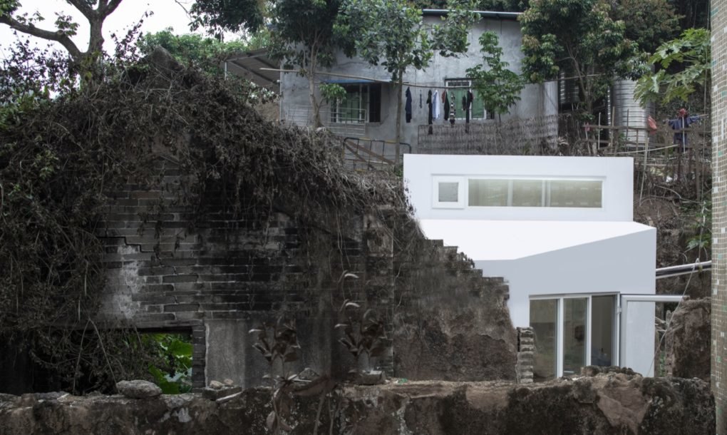 White house sitting on rocky hillside