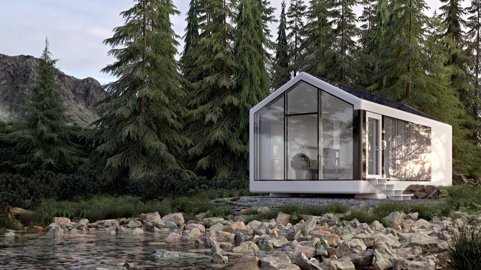 A pitch-roofed house with glass walls on a rocky shore with evergreen trees in the back. 