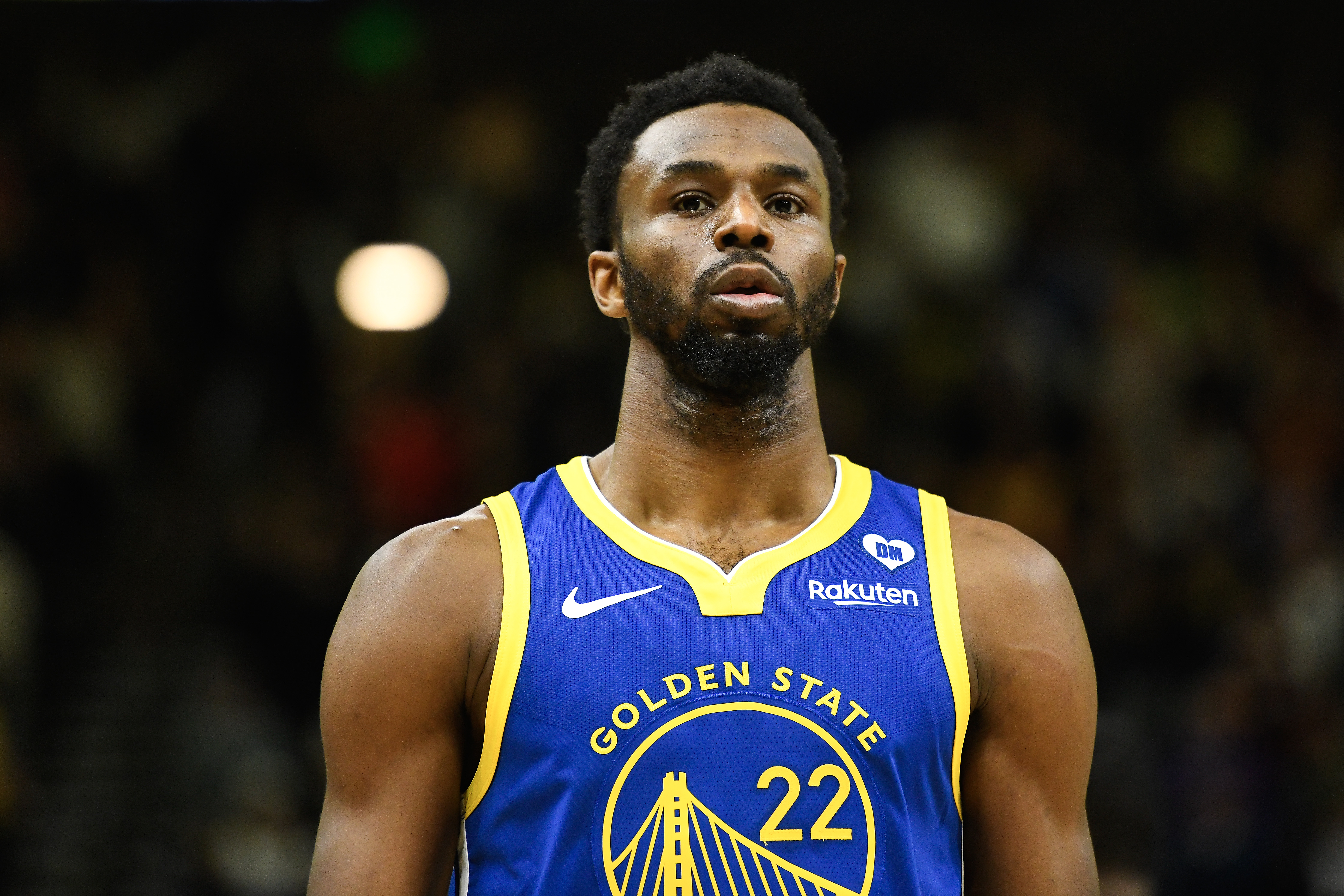 Close up of Andrew Wiggins in a blue Warriors jersey.