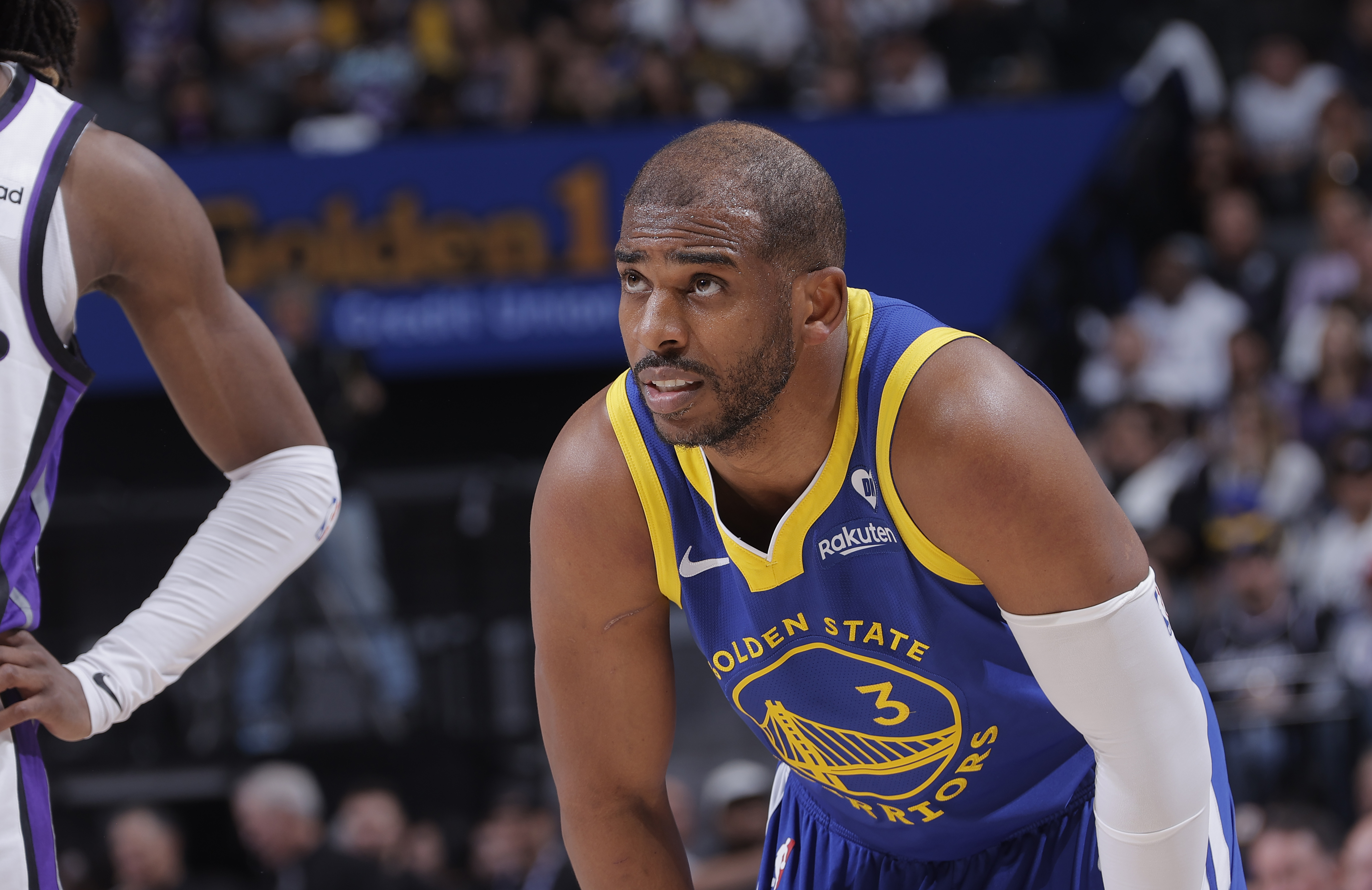 Chris Paul with his hands on his knees. 