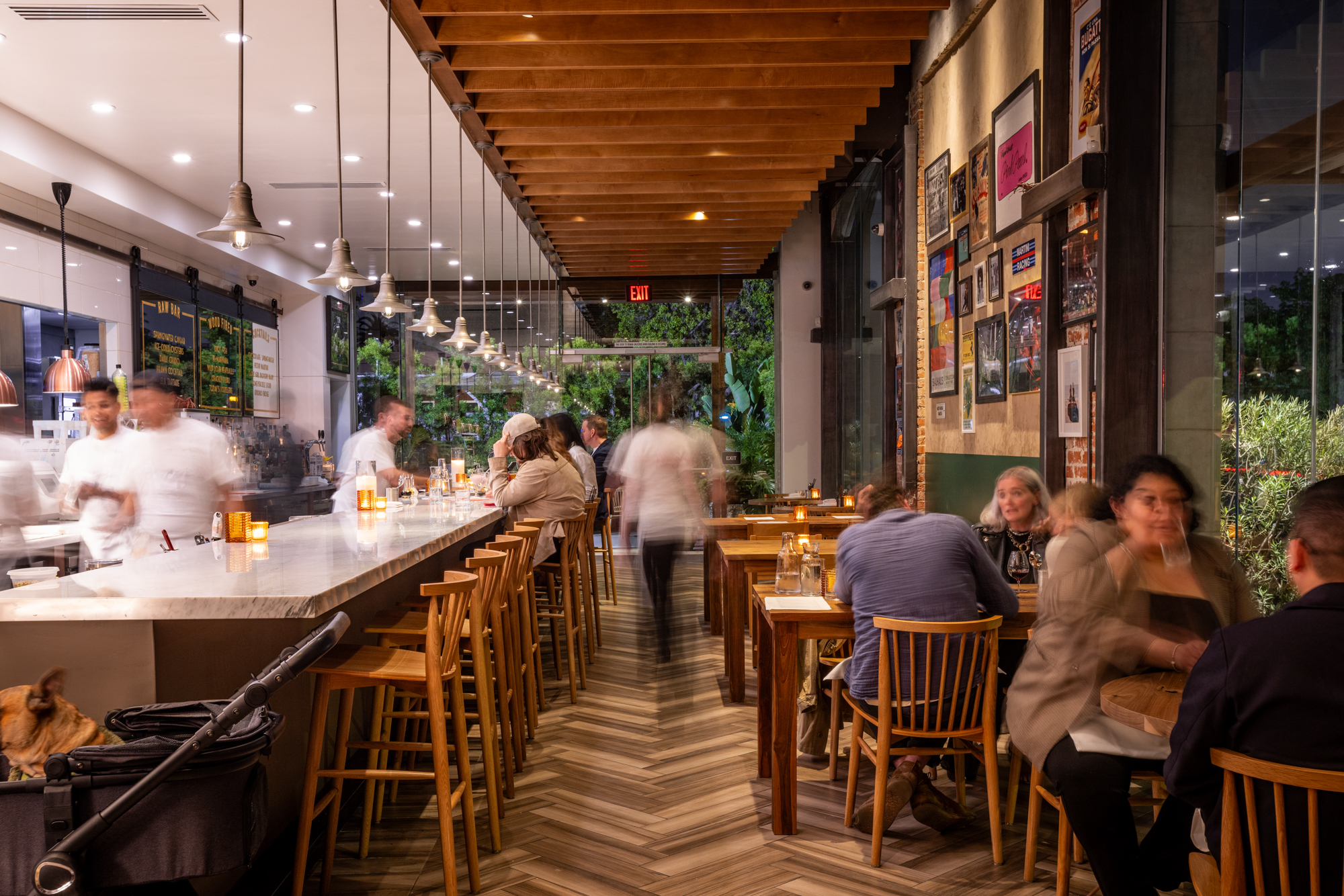 Diners and cooks inside Leopardo, a dinner restaurant in Los Angeles.