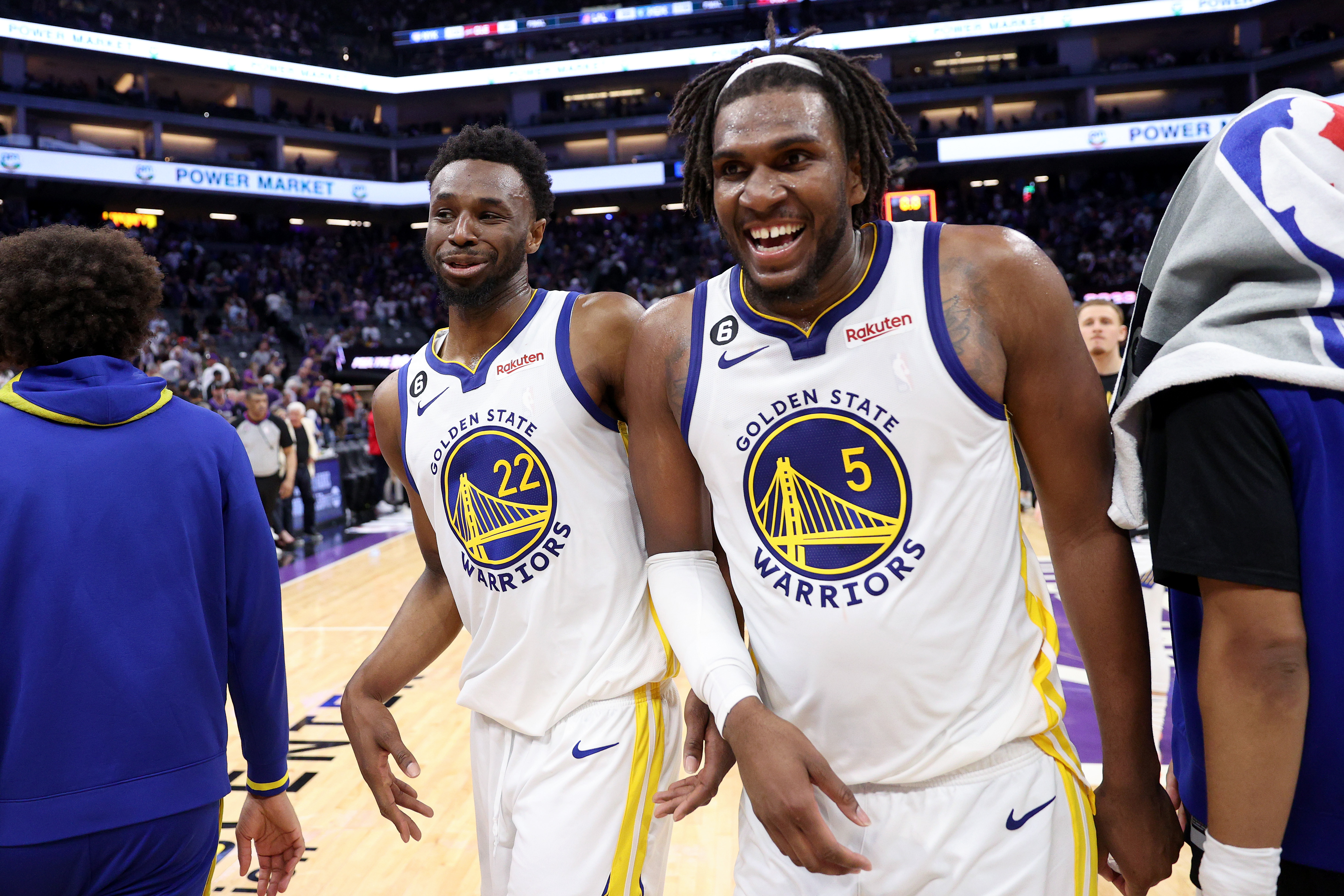 Andrew Wiggins and Kevon Looney laughing. 