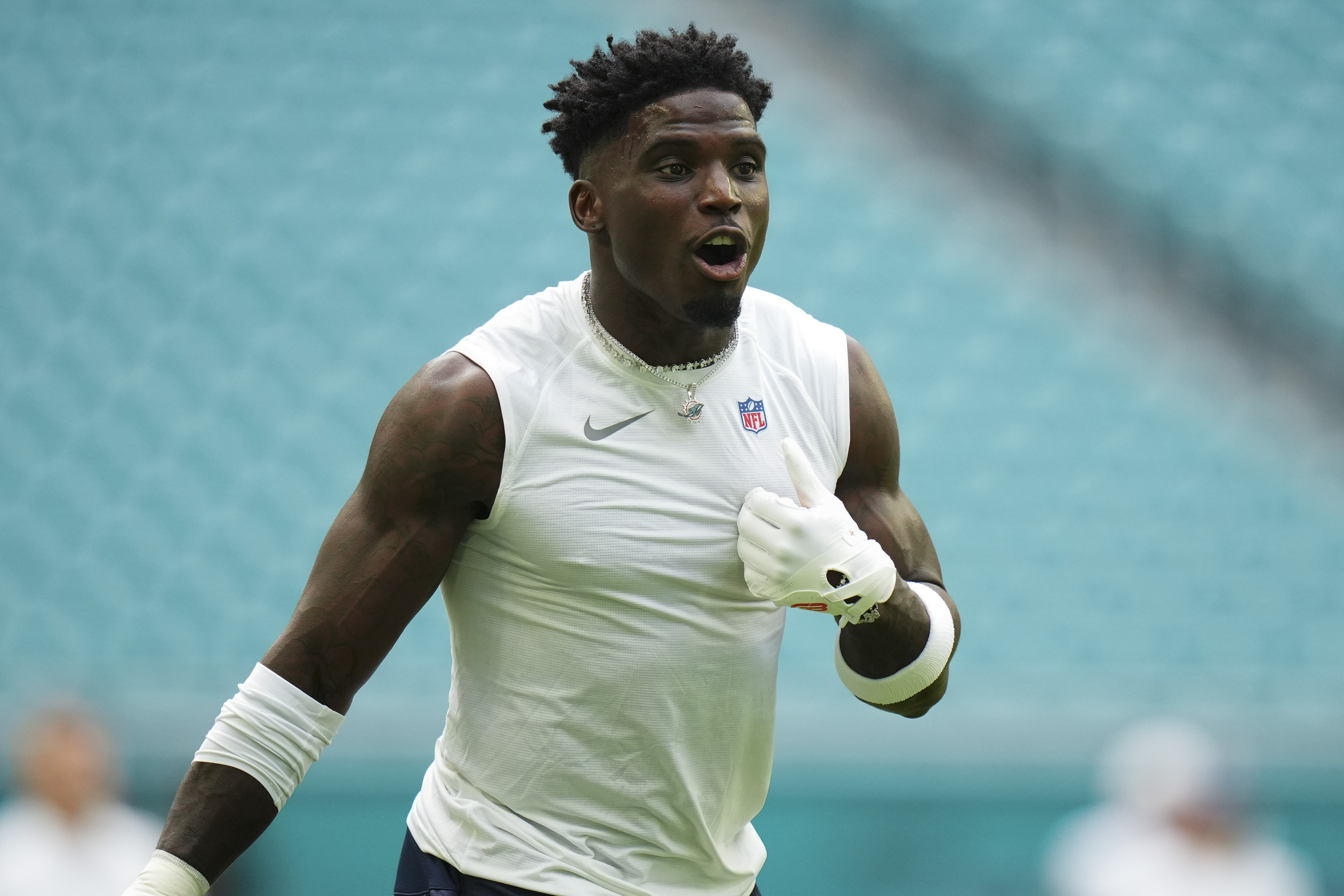 Tyreek Hill #10 of the Miami Dolphins warms up prior to a preseason game against the Washington Commanders at Hard Rock Stadium on August 17, 2024 in Miami Gardens, Florida.