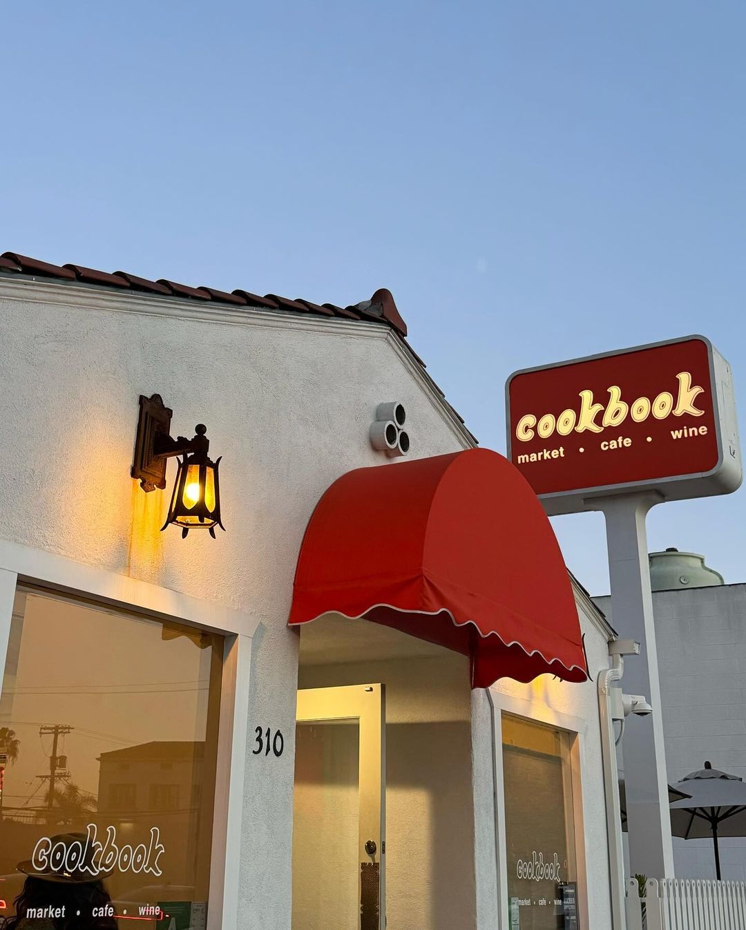 Cookbook Market in Larchmont Village with a red awning and sign that says “Cookbook.”