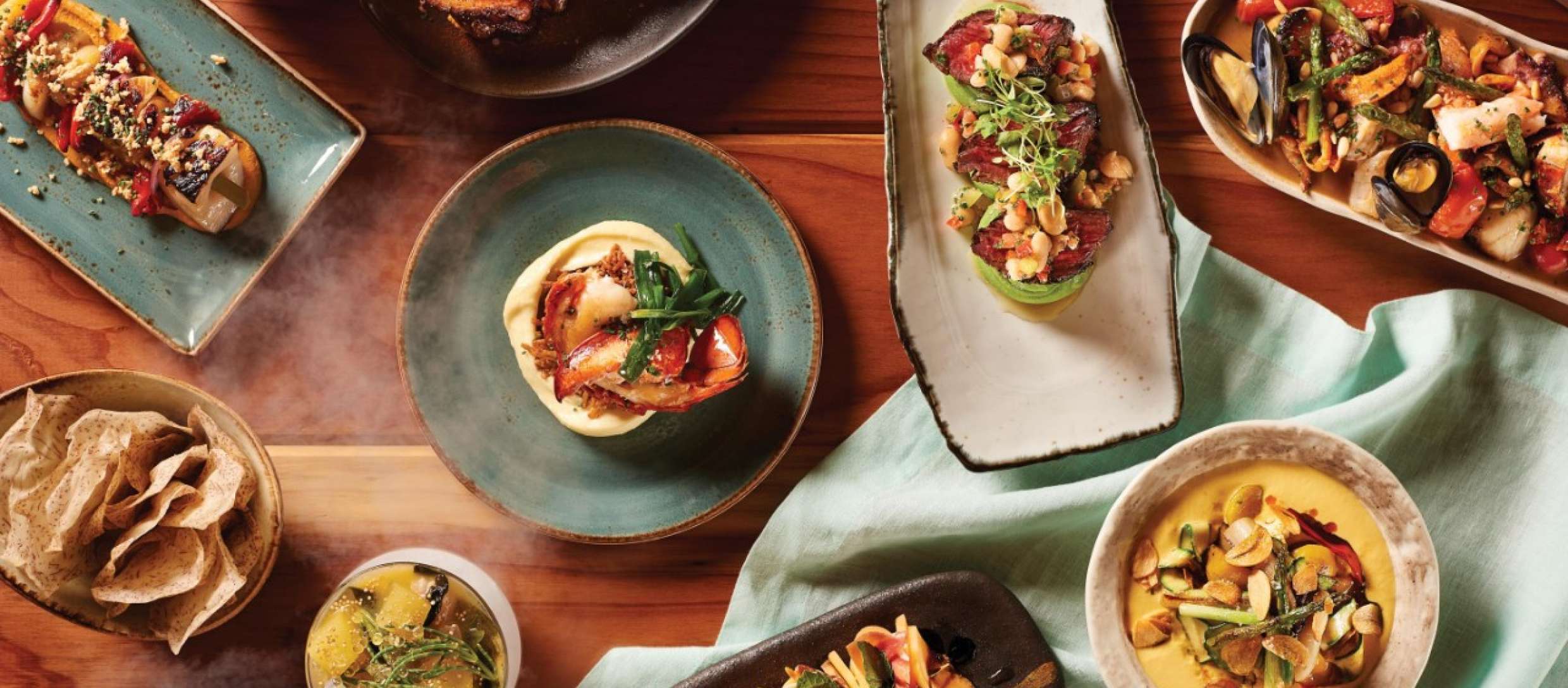 An array of tapas on a wooden table