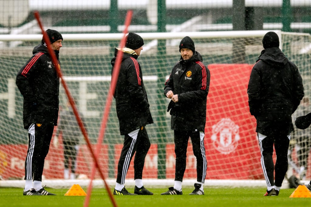 Erik ten Hag, Manager of Manchester United, interacts with their side during a training session ahead of their UEFA Europa League round of 16 leg o...