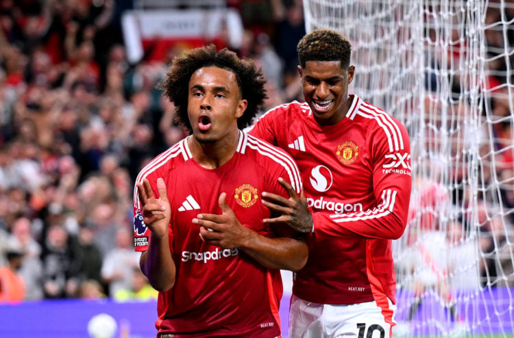 Joshua Zirkzee of Manchester United celebrates scoring his team's first goal with teammate Marcus Rashford during the Premier League match between ...