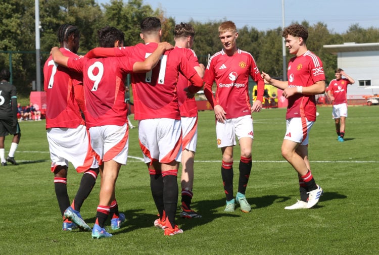 Tyler Fletcher of Manchester United celebrates with team mates after scoring his teams second goal during the U18 Premier League match between Manc...