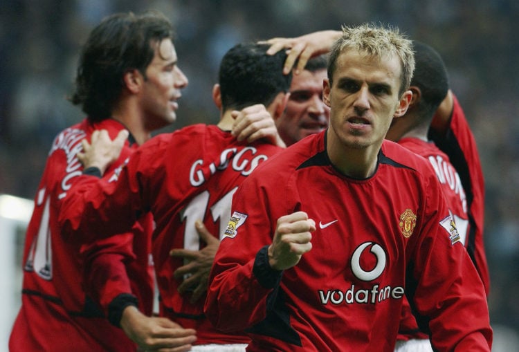 Phil Neville of Manchester United celebrates Paul Scholes scoring the first goal during the AXA FA Cup match between Manchester United and Manchest...