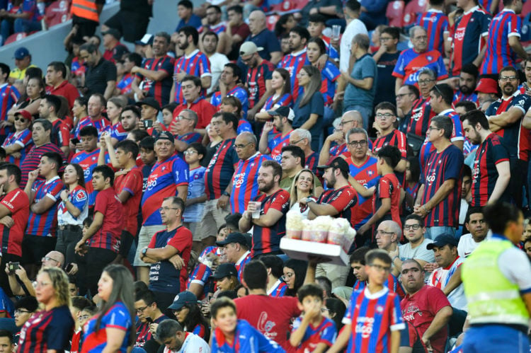 Fans of Cerro Porteño wait for the start of the Copa Libertadores group stage first leg football match between Paraguay's Cerro Porteño and Brazil'...