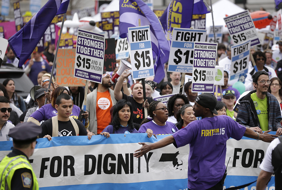 Low-wage workers and allies rally at an April march. Photo via AP