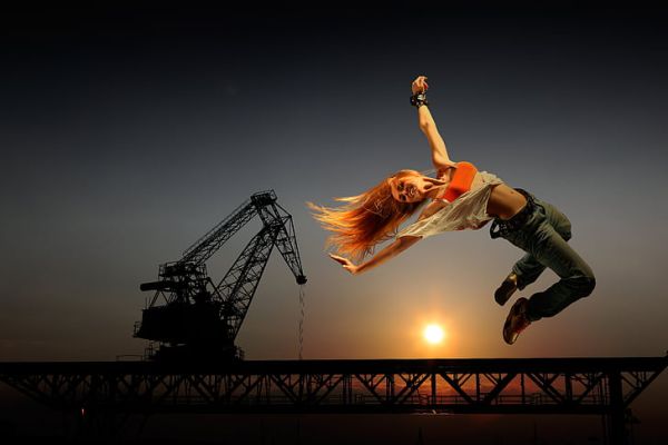 woman on air with crane background 