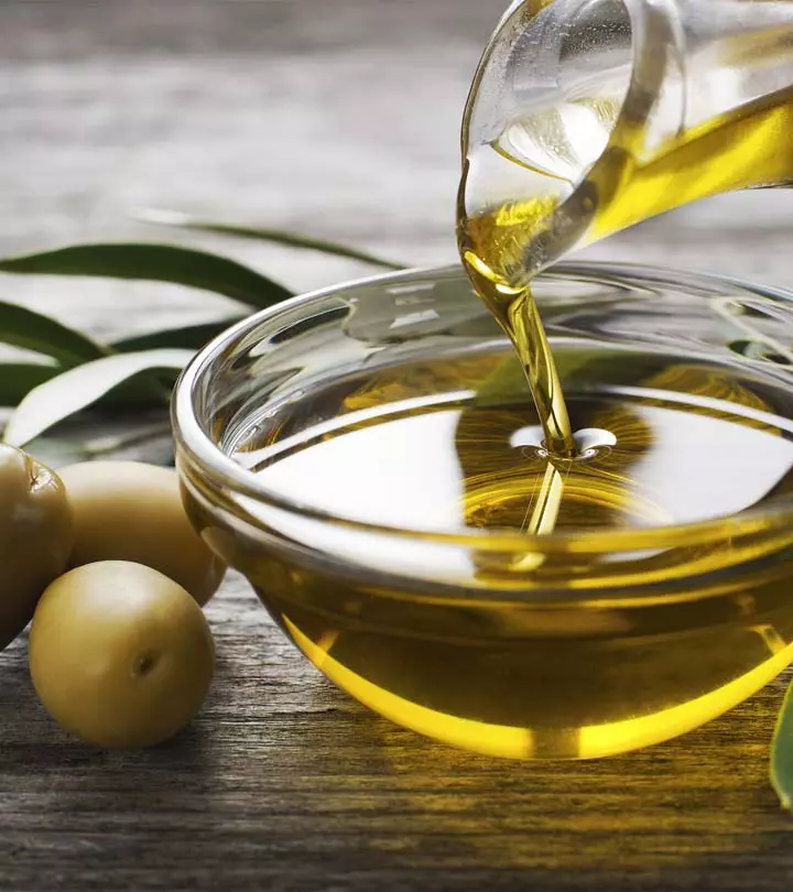 Woman Applying Olive Oil For Grey Hair