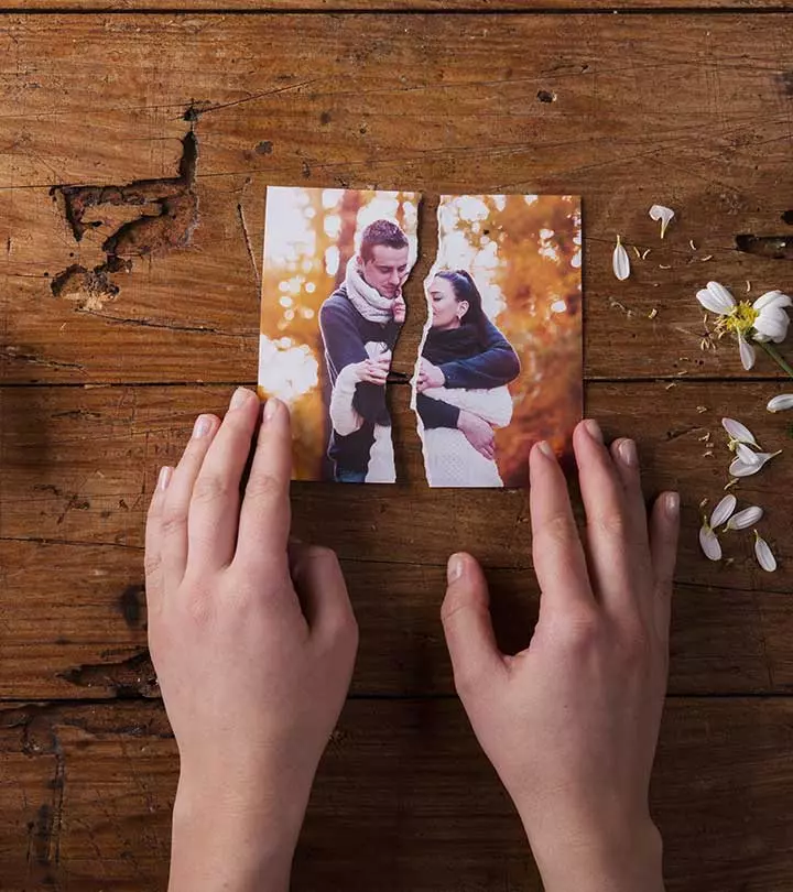 Post-breakup a girl tears their couple photo