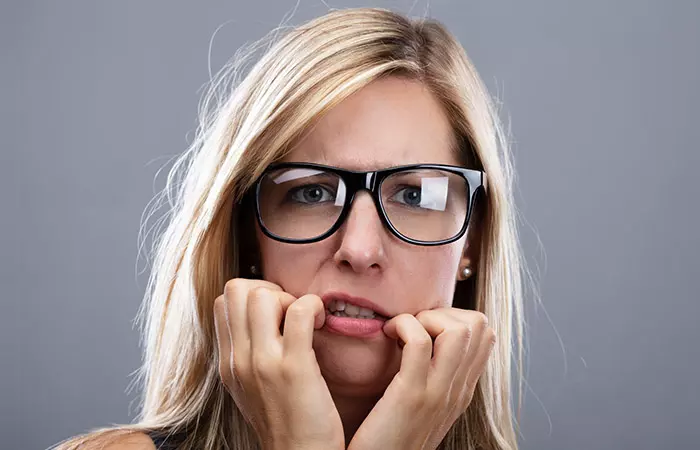 Woman with anxious and awkward expression