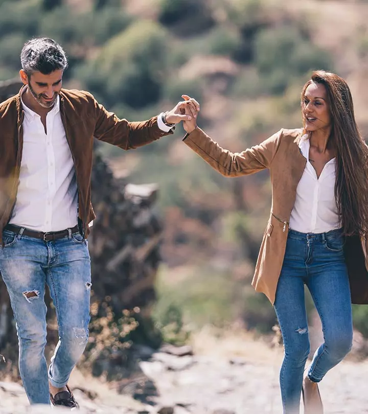 A couple holds their hands