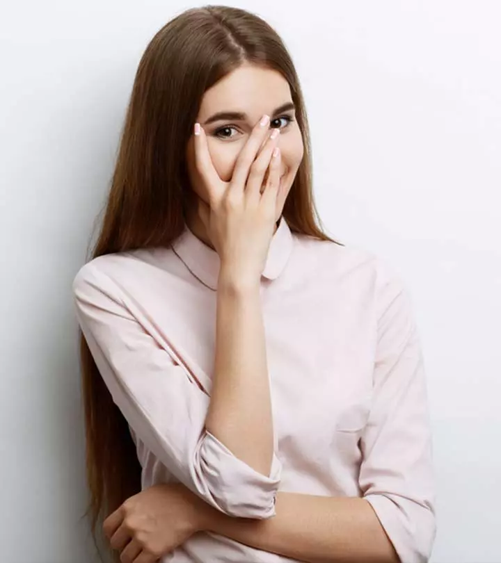 Girl making an awkward face after drinking the juice