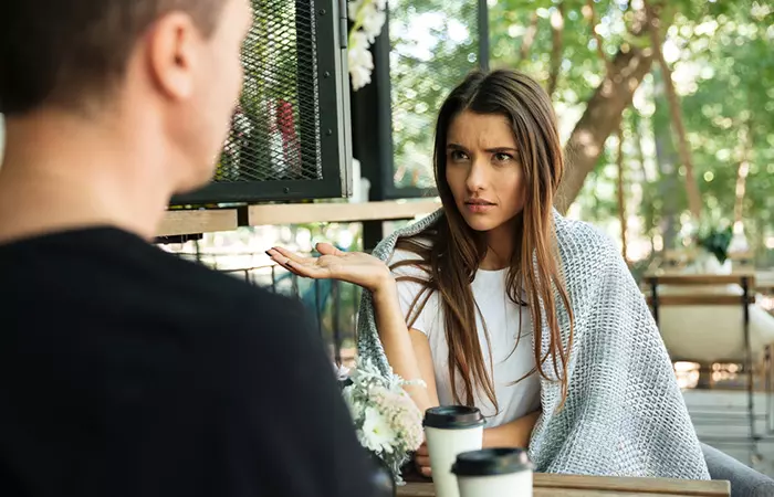 A dissatisfied woman in conversation with her partner.