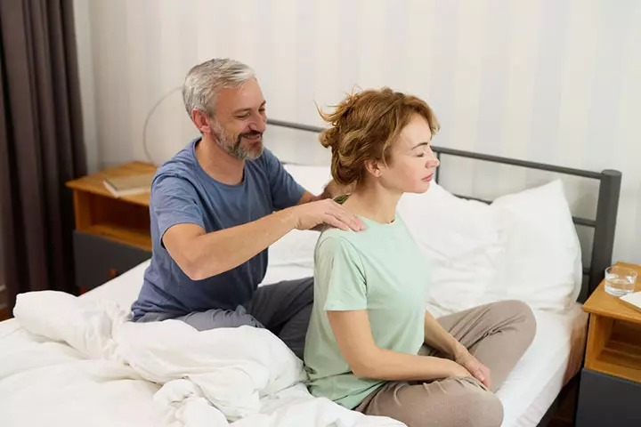 Husband giving massage to his wife