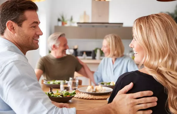 Couple looking at each other after meeting the man's parents.