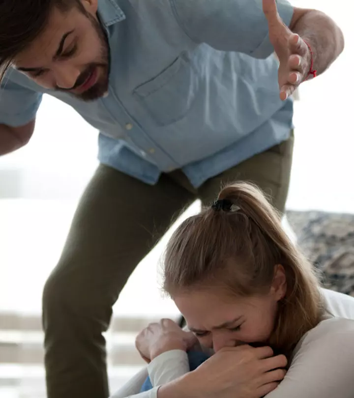 Post-breakup a girl tears their couple photo