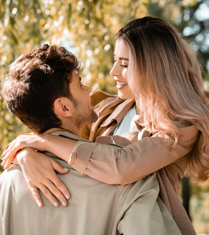 A couple holds their hands