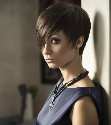 Woman with an asymmetrical long pixie cut and long side-swept bangs