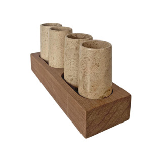 This is a beige tableware by Vanessa Sherwood called tequila shot glasses hand carved out of marble with wooden base - made in mexico (beige) in standard